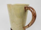 a coffee cup with a wooden handle on a white background