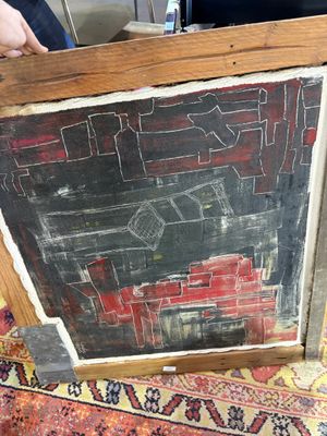 someone is holding a chalk board with a picture on it