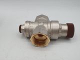 a close up of a metal pipe with a brass fitting