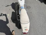a motor scooter that is parked in the parking lot