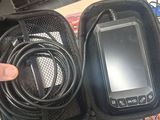 a person holding a cell phone in a case