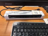 a keyboard and a mouse sitting on a desk next to a monitor