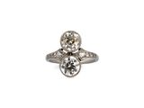 a close up of a diamond ring on a white background
