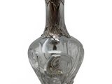 a glass vase that is sitting on a table
