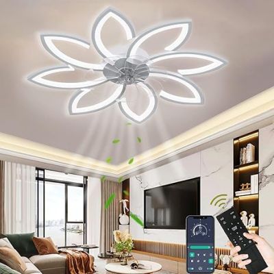 the person is holding a remote control in their hand in a living room