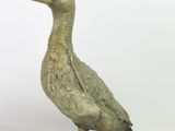 bronze statue of a duck on a white background