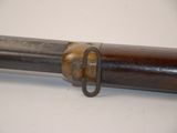 a close up of a gun with a metal handle