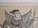 painting of a man holding a sword and wearing a hat