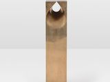 a close up of a metal object on a white surface