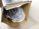 a cardboard box with a television in it on the floor