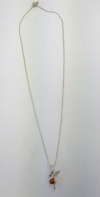 a silver necklace with an orange stone and a bird on it