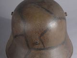 a helmet that is sitting on a table next to a pair of scissors