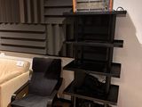 a living room with a couch, chair, and bookshelf in it