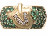 an image of a gold ring with green and white stones