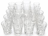 a lot of glasses that are sitting on a table