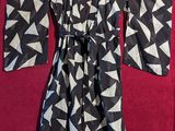 a black and white kimono robe with triangles on it