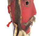 a mask of a man with a long beard and a hat