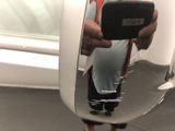 a man taking a picture of himself in a mirror