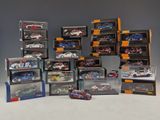 many different models of cars in a display case