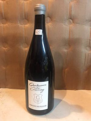 a bottle of wine that is sitting on a table