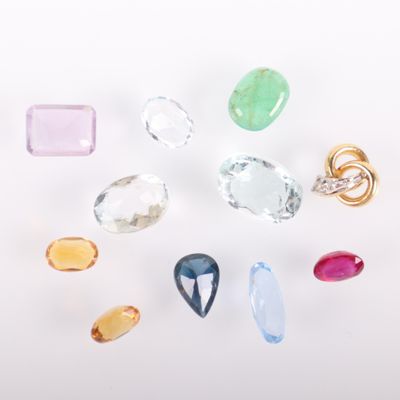 a group of different colored gems on a white surface