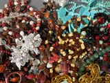 a pile of assorted jewelry sitting on a table