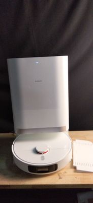 a white box sitting on top of a wooden table