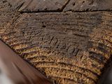 a close up of a piece of wood on a table