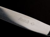 a knife that is sitting on top of a table