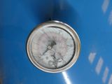 a close up of a pressure gauge on a blue tank