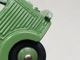 a green toy truck that is sitting on a table