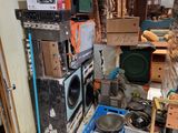 a pile of old appliances and other items in a room
