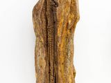 an old statue of a man in a robe and hat