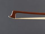 a close up of a violin bow with a wooden handle