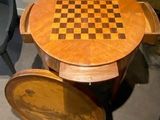 a wooden table with a chess board on top of it