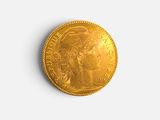 une image d'une pièce d'or sur une surface blanche