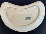 a small white bowl with a black label on it