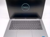 the dell laptop is open and ready to be used