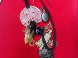 a picture of a necklace on a red cloth