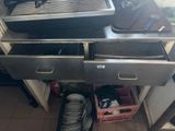 a kitchen with a sink, stove, and a dishwasher in it