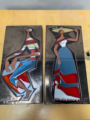 painting of a woman with a hat and a dress on a table