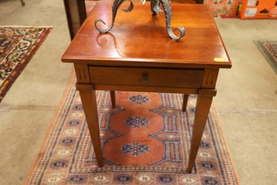 a small table with a statue of a horse on it