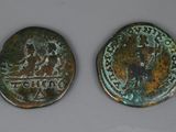 two ancient roman coins, one of which is a horse and the other of which is a horse