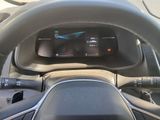 steering wheel of a car with a digital display on the dashboard