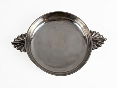 an image of a silver plate with a decorative design on it