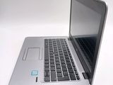 a laptop that is sitting on a white table