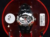 a black and red watch in a red case