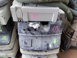 several vacuums are stacked on top of each other on the floor