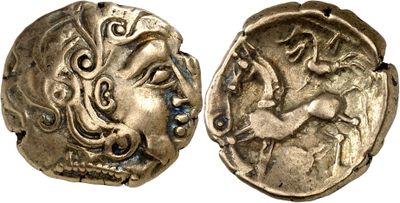 a close up of a coin with a face on it