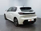 the rear end of a white toyota yaris parked in a white room